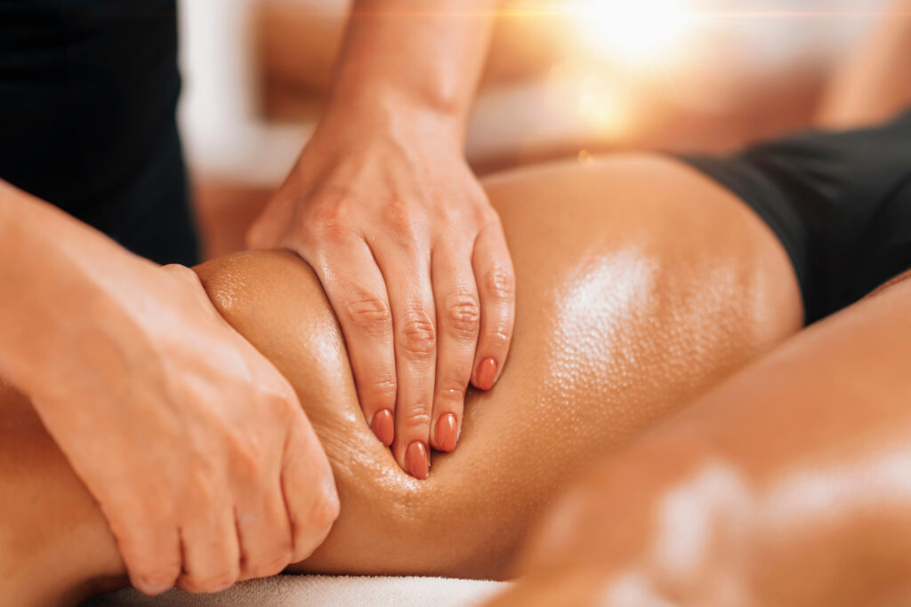 Anti cellulite female thigh massage at a beauty spa salon. Body care concept.